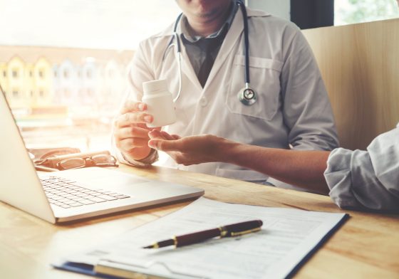 Doctor giving patient a heartburn medication sample