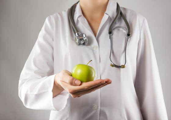doctor holding an apple