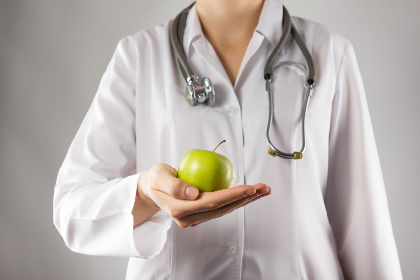 doctor holding an apple