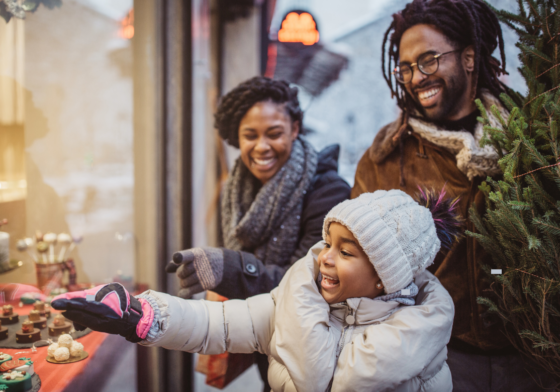 African American family with holiday tree and kid